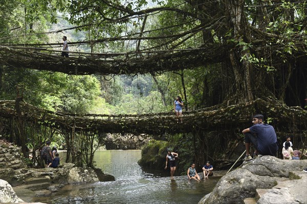 Tourists at the Bouble decker living root bridge amid COVID-19 coronavirus pandemic, in Nongriat village in Northeastern India state Meghalaya, on 19 April 2021. The living root bridges, created by the members of the Khasi tribe who have grown them from rubber trees, are native to the region. The double-decker root bridge, is the most famous one near Cherapunji