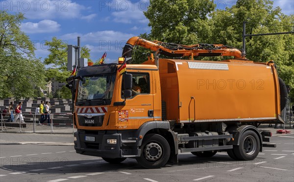 Operational vehicle of the Berlin city cleaning service with German flags on the driver's cab, Berlin, Germany, Europe