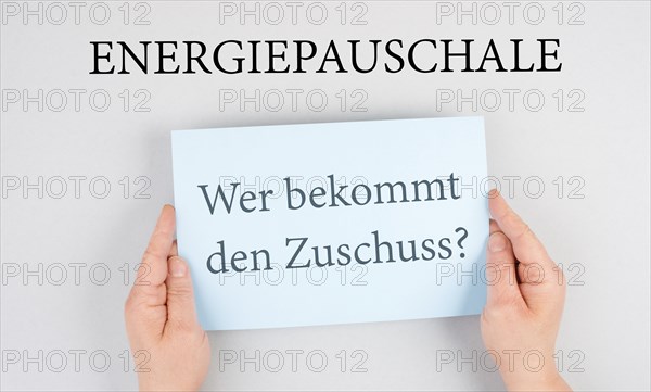 Energy flat rate, who receives the subsidy is standing in german language on the paper, finanical help for increasing prices