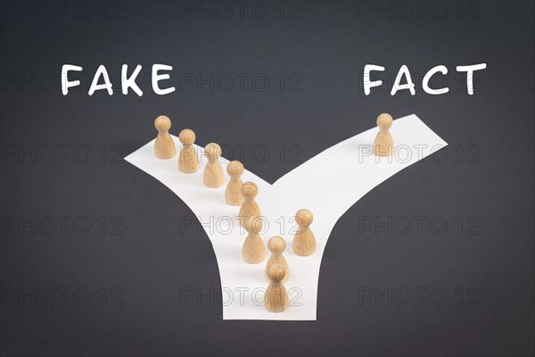 Crowd of people follow the path to the fake information, one thinks different and takes his own way and decisions, propaganda and conspiracy theory concept, media and manipulation issue