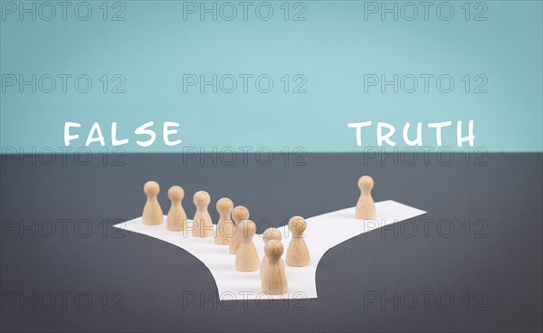 Crowd of people follow the path to the false information, one thinks different and takes his own way and decisions, propaganda and conspiracy theory concept, media and manipulation issue