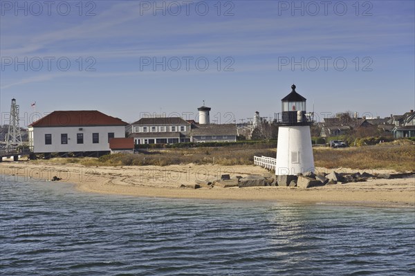 The Brant Point Lighthouse at the entrance to Nantucket Harbor. The 26 foot tall white wooden lighthouse, which welcomes visitors to Nantucket Harbour, is the shortest in New England, USA, North America