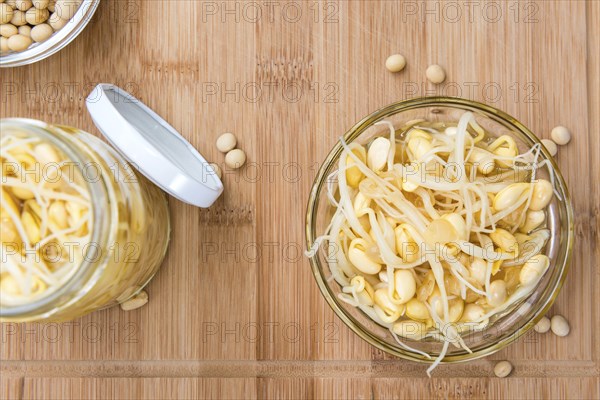 Preserved Soy Sprouts (close-up shot) on wooden background