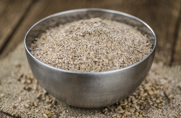 Portion of Wheat Bran as detailed close-up shot, selective focus