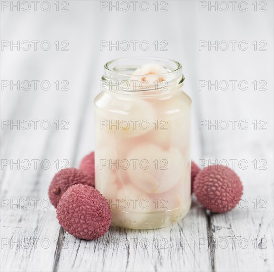 Preserved Lychees on a vintage background as detailed close-up shot (selective focus)