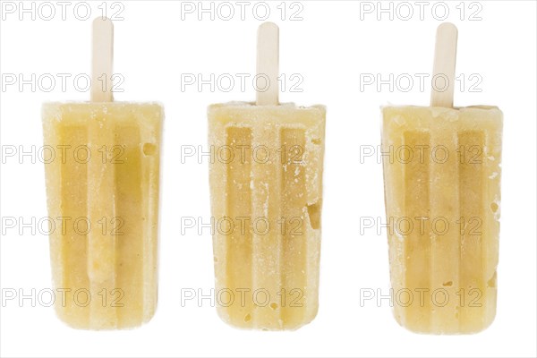 Fresh made Apple Popsicles (close-up shot) isolated on white background