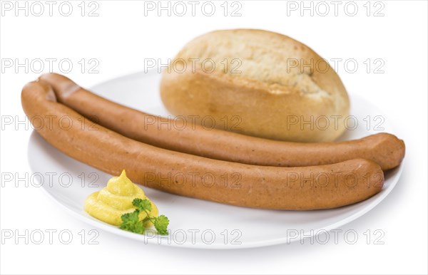 Portion of Wiener Sausages (as close-up shot) isolated on white background