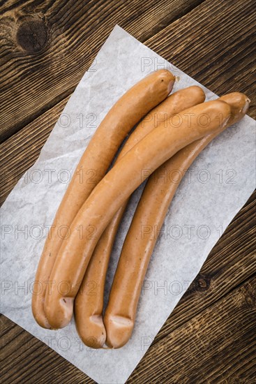 Fresh made German Sausages (Wiener) on a vintage background (close-up shot)