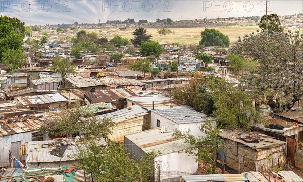 Poor townships next to Johannesburg, South Africa, with a dramatic sky, Africa