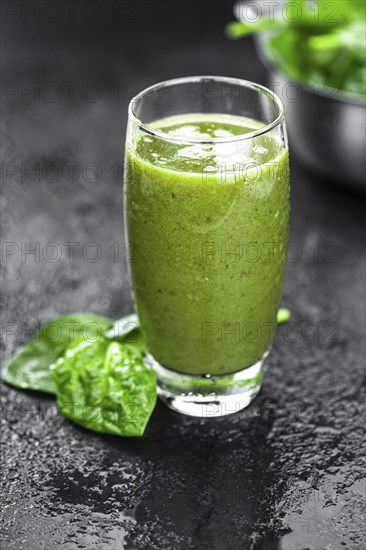 Homemade spinach smoothie (detailed close up shot, selective focus)