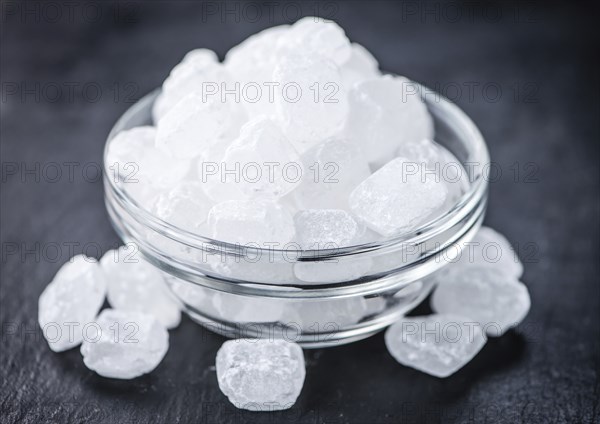 Slate slab with a portion of white Rock Candy (selective focus, close-up picture)