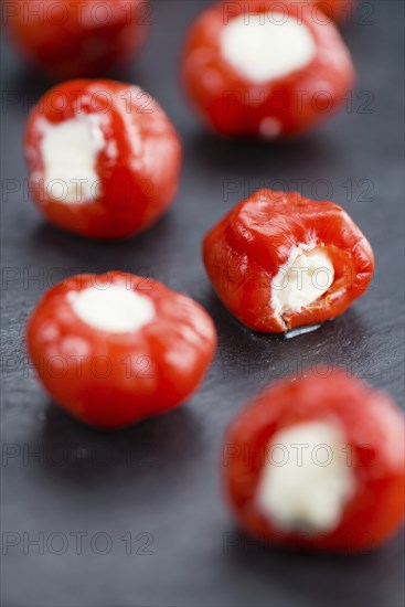 Homemade Filled Pimientos on vintage background (selective focus, close-up shot)