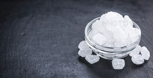 Slate slab with white rock sugar (selective focus, close-up shot)