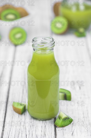 Fresh made Kiwi Smoothie (selective focus) on a vintage looking background