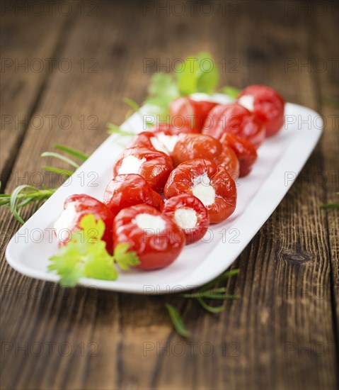 Some homemade Red Pepper (stuffed with cheese) (selective focus) as detailed close-up shot