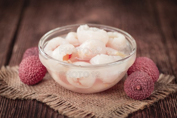 Preserved Lychees on a vintage background as detailed close-up shot (selective focus)