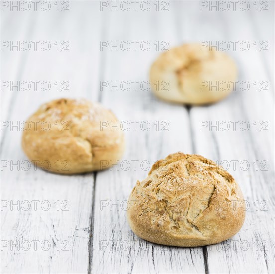 Fresh made German Buns on a vintage background as detailed close-up shot