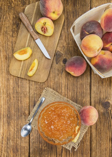 Portion of fresh Peach Jam close-up shot, selective focus