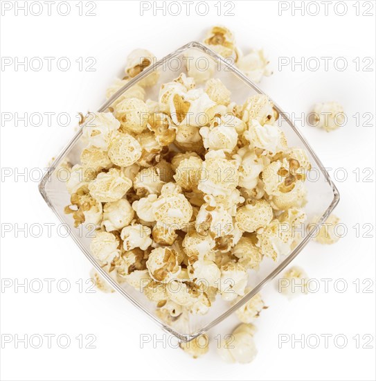 Fresh made Popcorn isolated on white background, close-up shot