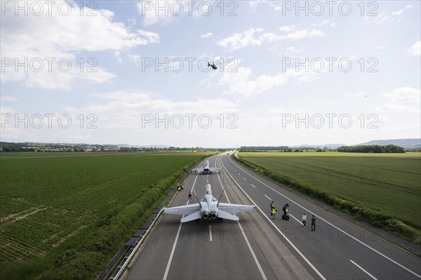 Swiss Air Force F/A 18 fighter aircraft take off and land on the A1 motorway during the Alpha Uno exercise in Payerne on Wednesday, 5 June 2024. The purpose of the military exercise is to strengthen the defence capability of the Swiss Armed Forces through so-called decentralisation. (DDPS/DDPS, Alex Kuehni)