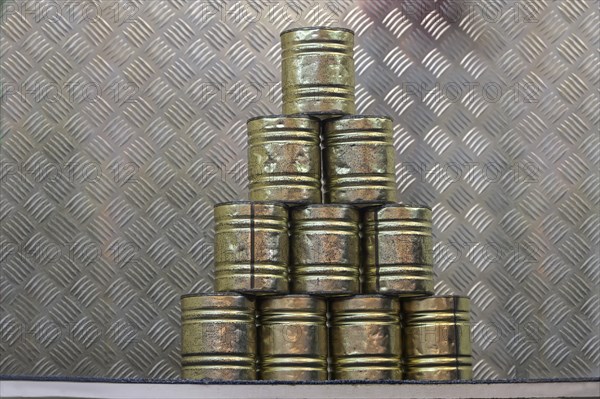 Stacked tin cans for a throwing game at a carnival funfair or Christmas market, copy space, selected focus