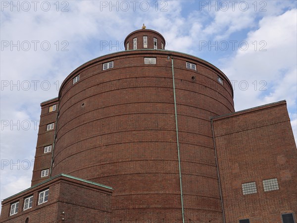 A massive brick building with a round dome rises into the sky on a cloudy day, Kappeln, Schleswig-Holstein, Germany, Europe