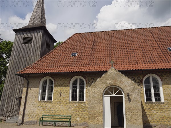 Small brick church with wooden tower and red tiled roof in summer, Kappeln, Schleswig-Holstein, Germany, Europe