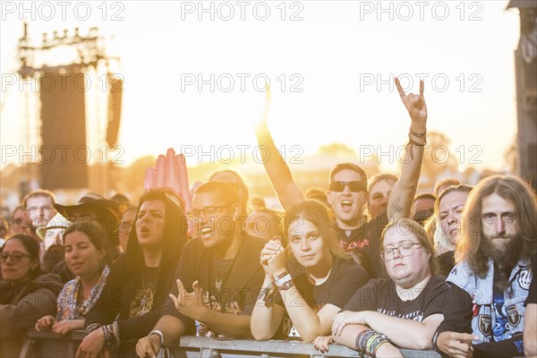 Festival-goers in the front row give the devil's salute at the Wacken Open Air in Wacken. The traditional metal festival takes place from 31 July to 3 August 2024