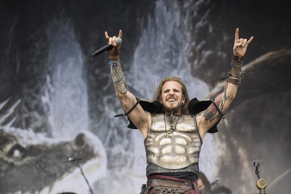 Captain Feuerschwanz, singer of the band Feuerschwanz, shows the metal salute at the Wacken Open Air in Wacken. The traditional metal festival takes place from 31 July to 3 August 2024