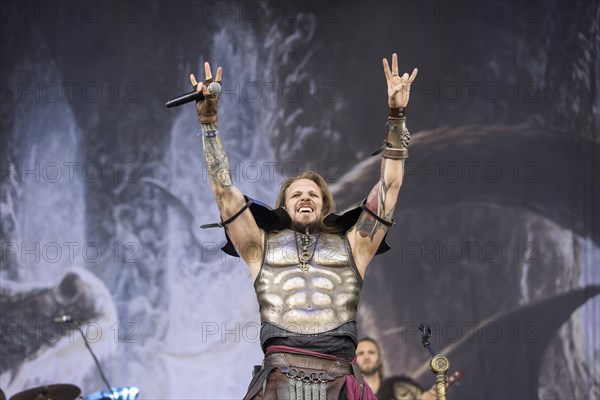 Captain Feuerschwanz, singer of the band Feuerschwanz, shows the metal salute at the Wacken Open Air in Wacken. The traditional metal festival takes place from 31 July to 3 August 2024