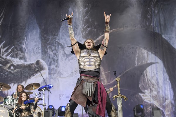 Captain Feuerschwanz, singer of the band Feuerschwanz, shows the metal salute at the Wacken Open Air in Wacken. The traditional metal festival takes place from 31 July to 3 August 2024