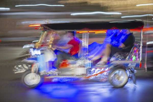 Tuk Tuk in traffic at night, Bangkok, Thailand, Asia