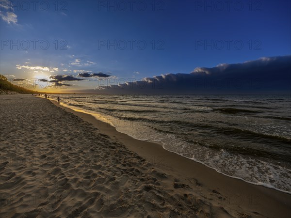 Sunset on a sandy beach on the island of Usedom on the Baltic Sea, Zempin, Mecklenburg-Western Pomerania, Germany, Europe