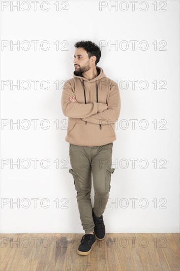 Portrait of a latin man looking to the side. White background