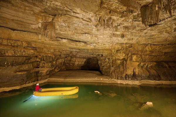 Karst cave, lake, rubber dinghy, speleologist, Krizna jama, Cerknica, Carniola, Slovenia, Europe