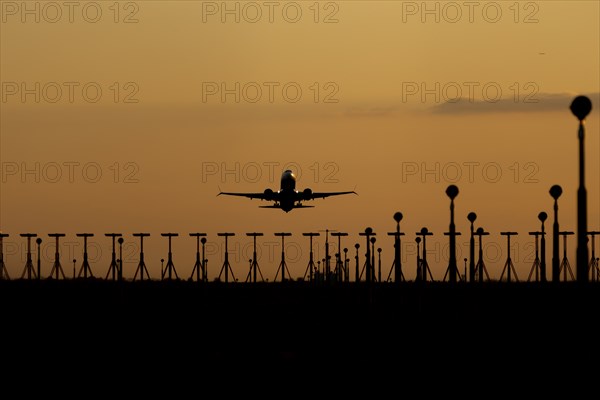 Boeing 737 aircraft taking off at sunset from London Stansted airport, Essex, England, United Kingdom, Europe