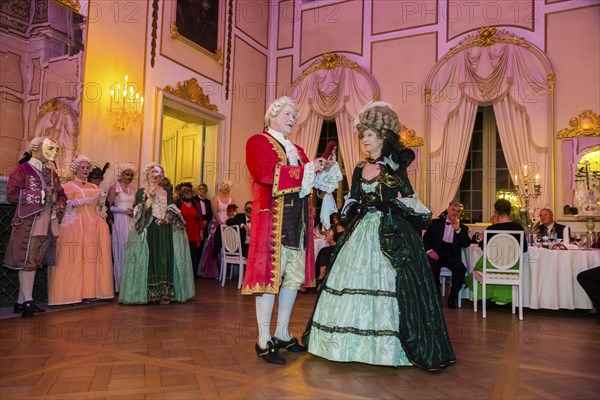 Masquerade ball at Rammenau Baroque Palace, Rammenau Palace in Rammenau near Bischofswerda in the district of Bautzen is one of the most beautiful preserved Baroque country palaces in Saxony. The les danseurs de Sans Souci as guests at the masked ball. With their historical dances, the costumed performers were a highlight of the evening