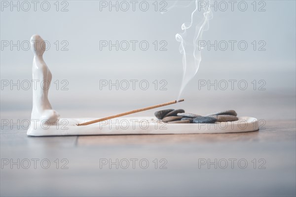 Burning aromatic incense stick for yoga and meditation. Calmness