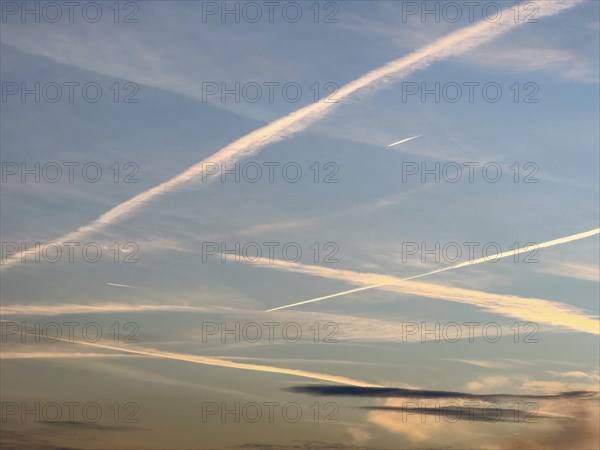 Several many tens of condensation trails high thin clouds artificially created by aircraft engines homomutatus man-made with by jet aircraft jet aircraft jet aircraft jet turbines of passenger aircraft mistakenly chem trails chem trails, international