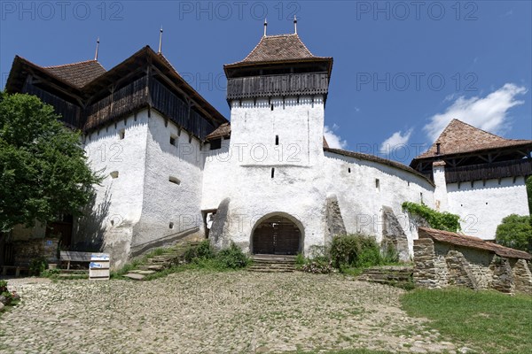 The Protestant Church Church Castle Deutsch-Weisskirch, Biserica Evanghelica C.A. Fortificata Viscri, in Transylvania. The church is a fortified church, built with a wall like a fortress and with embrasures for defensive purposes. It is a UNESCO World Heritage Site. Deutsch-WeiÃŸkirch, Brasov County, Transylvania, Romania, Southeast Europe, Europe