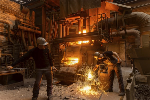 The Schmees foundry in Pirna, Germany, taking a sample of the molten metal, Europe