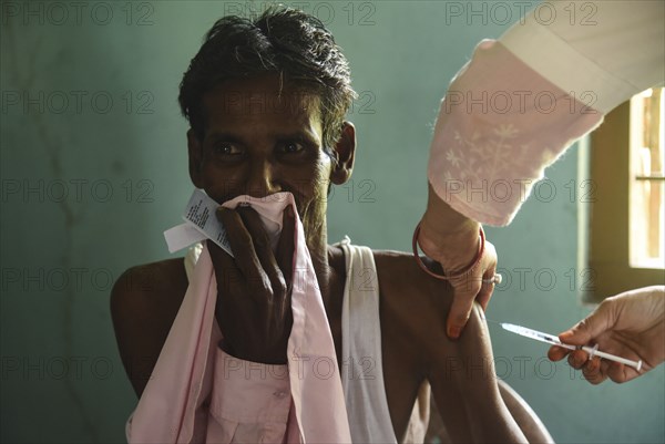 Beneficiaries receives dose of COVID-19 coronavirus vaccine in a vaccination centre at a village in Barpeta, Assam, India on 20 September 2021