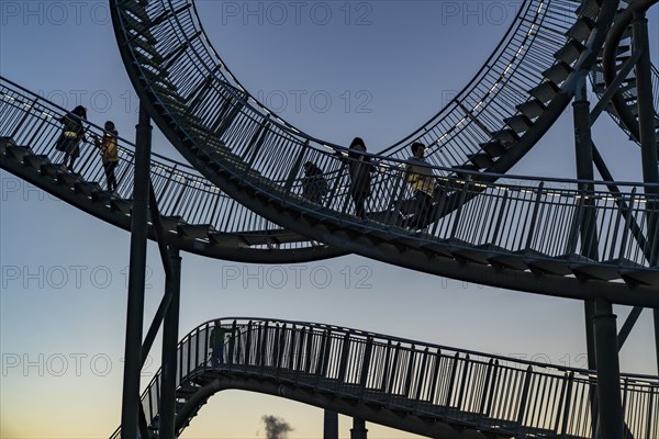 Landmark Angerpark Tiger & Turtle, Magic Mountain, walk-in sculpture in the form of a rollercoaster on the Heinrich-Hildebrand-Höhe spoil tip, HKM steelworks, sunset, Duisburg, North Rhine-Westphalia, Germany, Europe