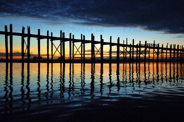 Myanmar, Wooden bridge at Inle Lake at sunset, Inle Lake, Myanmar, Asia