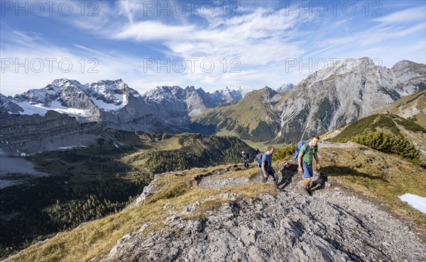 Two mountaineers on a hiking trail, mountain panorama with rocky steep peaks, view of summits Laliderspitze, Dreizinkenspitze and Spritzkarspitze, hike to the summit of Hahnkampl, Engtal, Karwendel, Tyrol, Austria, Europe