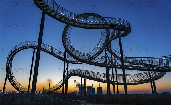 Landmark Angerpark Tiger & Turtle, Magic Mountain, walk-in sculpture in the form of a rollercoaster on the Heinrich-Hildebrand-Höhe spoil tip, HKM steelworks, sunset, Duisburg, North Rhine-Westphalia, Germany, Europe