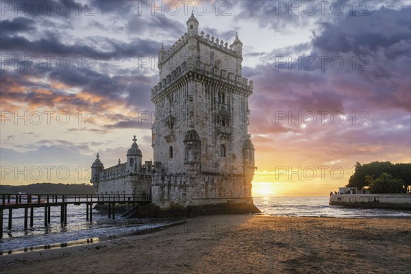 Belem Tower or Tower of St Vincent, famous tourist landmark of Lisboa and tourism attraction, on the bank of the Tagus River Tejo on sunset. Lisbon, Portugal, Europe