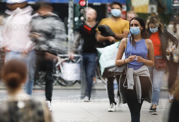 Dense crowds around Alexanderplatz. People with masks. Difficult to keep the distance rule. Don't get infected. Germany is slowly opening up again. Shops, cafés, restaurants, shopping centres are now allowed to reopen, Berlin, 22.05.2020