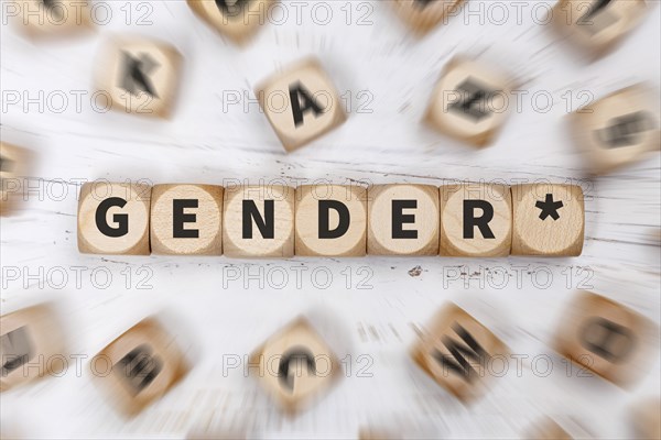 Gendering with gender stars as a symbol for gender-appropriate language on dice Communication concept in