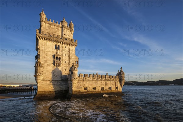 Belem Tower or Tower of St Vincent, famous tourist landmark of Lisboa and tourism attraction, on the bank of the Tagus River Tejo on sunset. Lisbon, Portugal, Europe